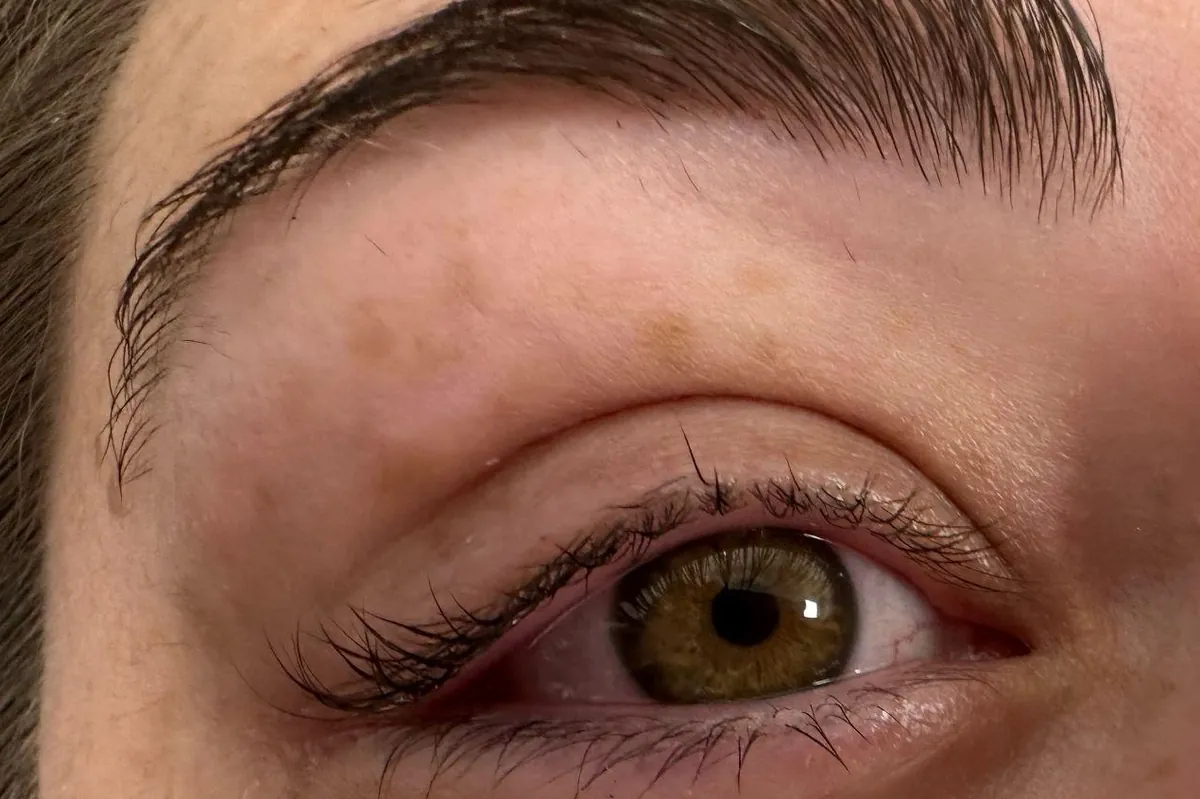 Before: a client's eye with natural lashes and no eyeliner
