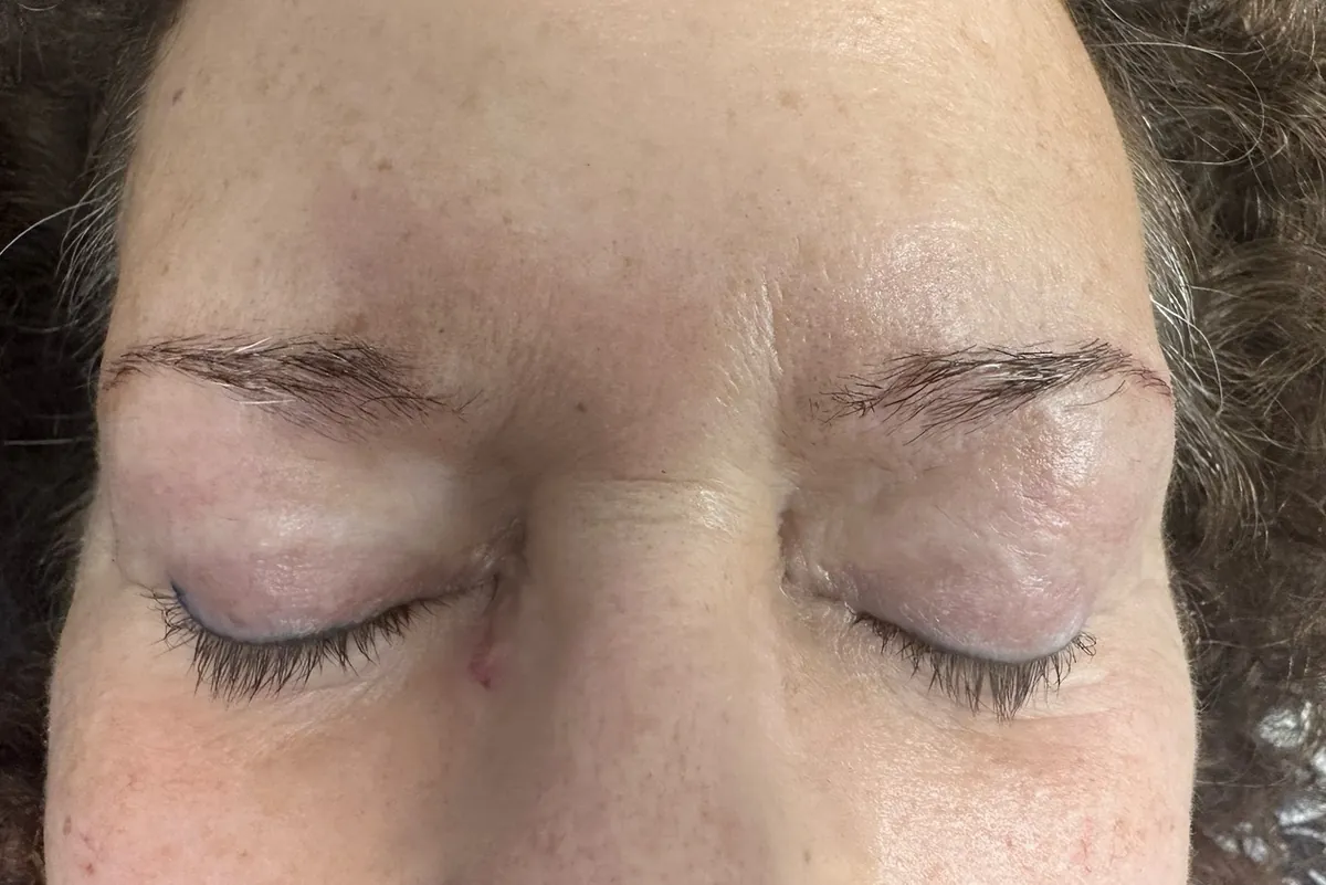 Before: a client's light, sparse brows, eyes closed
